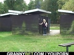 Blonde granny ride stranger's cock on public