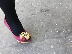 Lady L walking with red high heels.